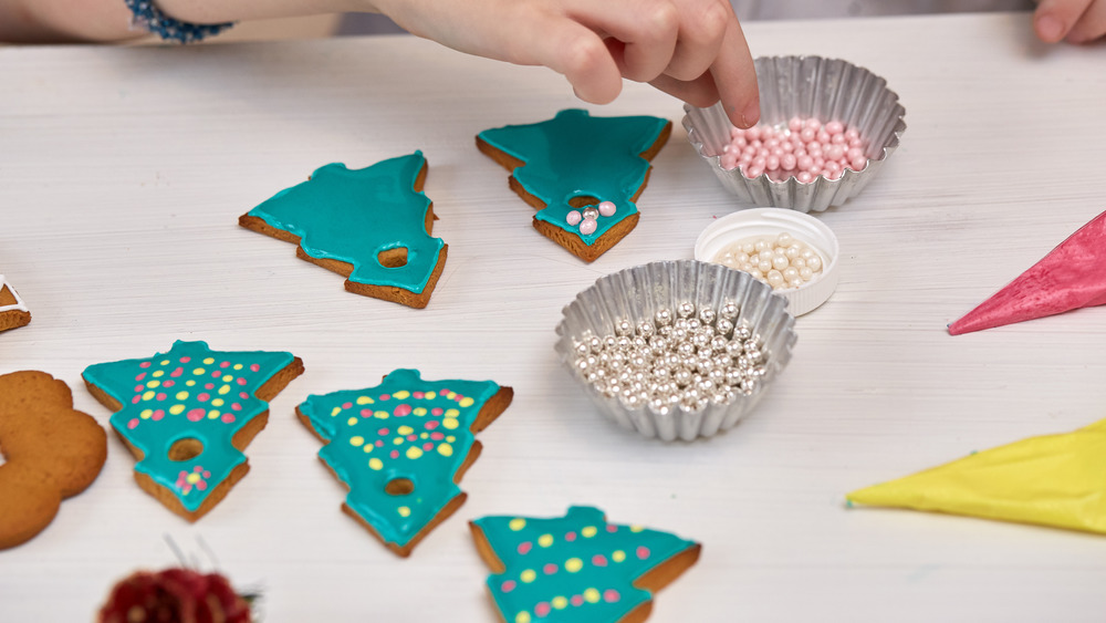 Woman decorating sugar cookies