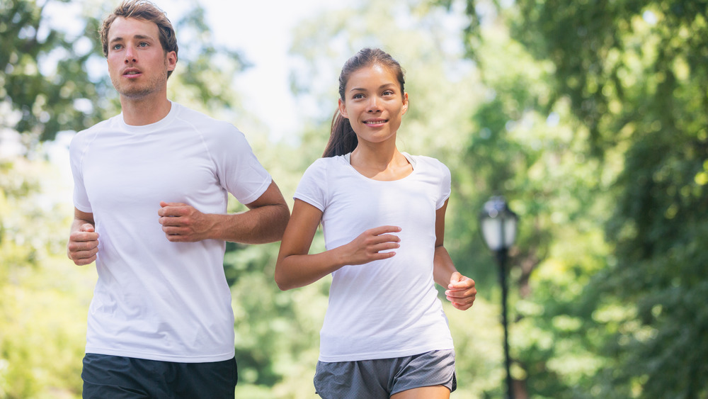 Man and woman jogging together