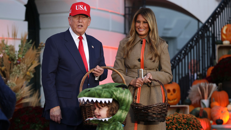 Donald and Melania Trump handing out candy on Halloween at the White House
