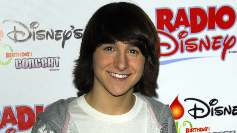 mitchel musso posing at disney event