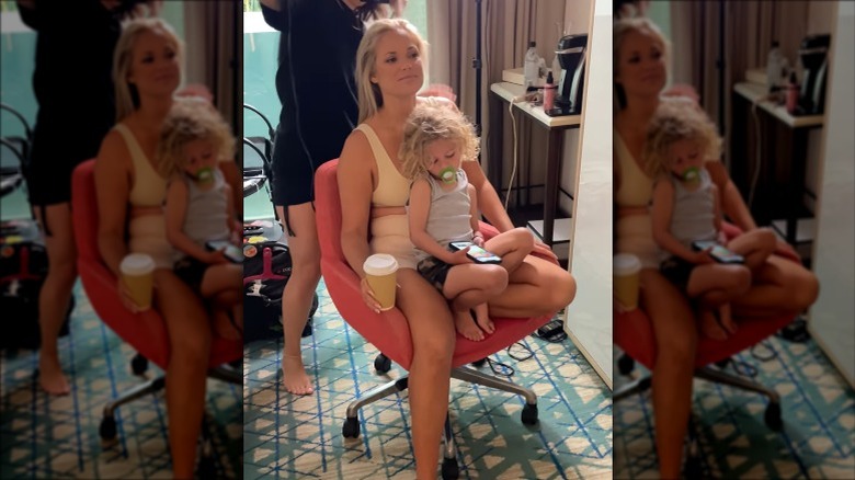 Kelly Hughes, son on her lap