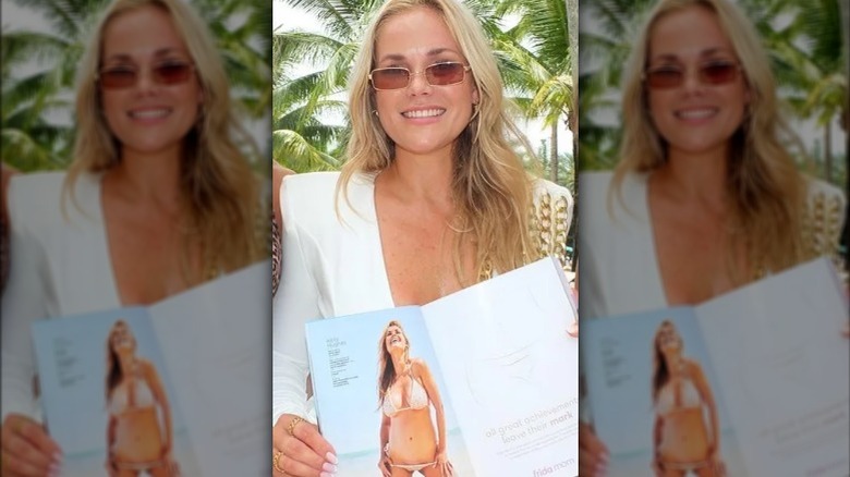 Kelly Hughes showing her magazine photo