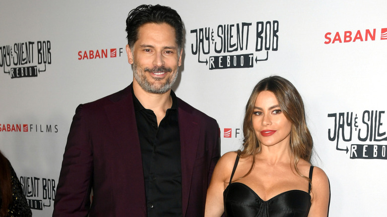 Joe Manganiello and Sofía Vergara posing together on a step and repeat