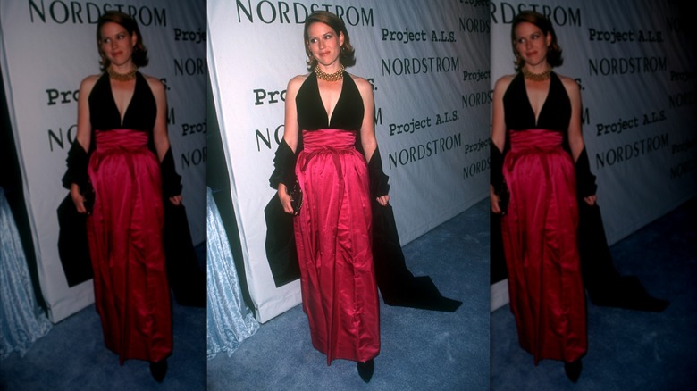 Molly Ringwald in a black-and-pink dress on the red carpet