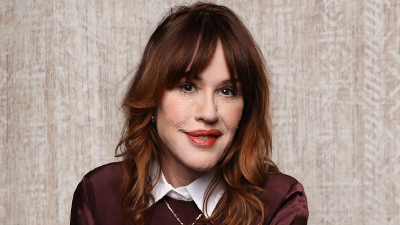 Molly Ringwald smirking
