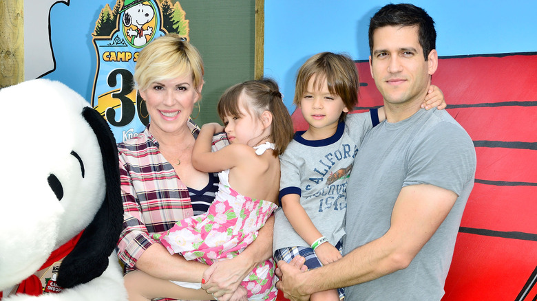Molly Ringwald, Panio, Adele, and Roman Gianopoulos smiling at Camp Snoopy's 30th anniversary VIP party in 2014