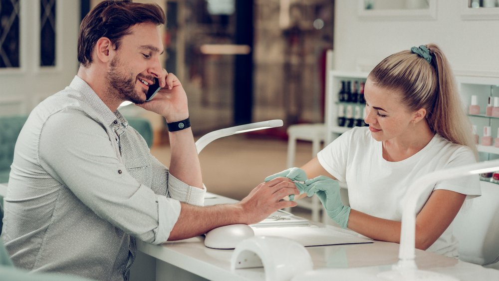 Man getting nails done