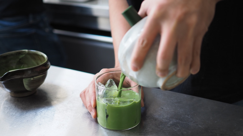 Person making matcha tea