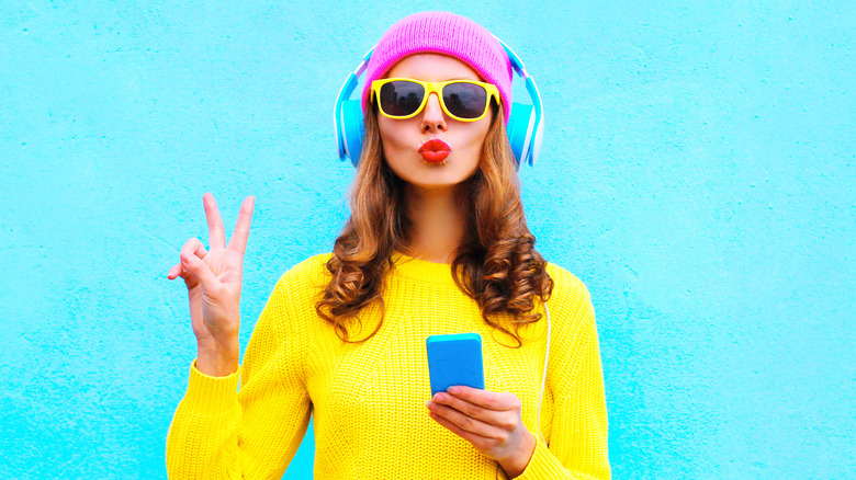 Woman doing peace sign