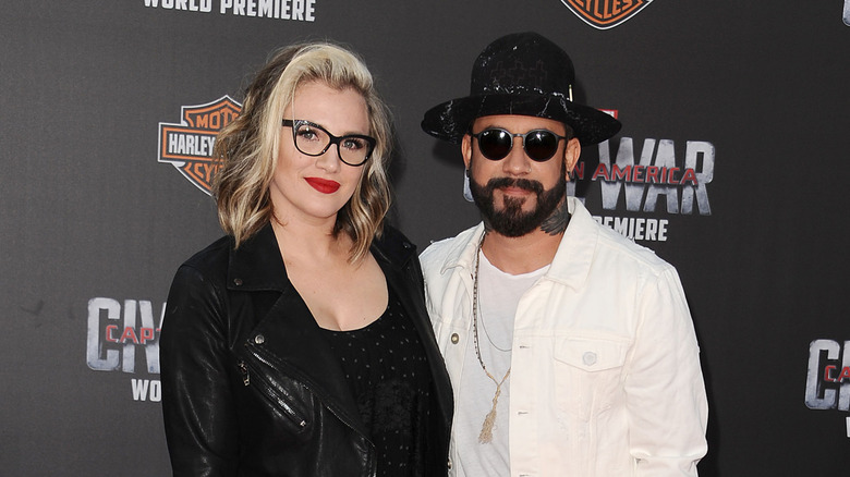 AJ and Rochelle McLean with close mouthed smiles taking a picture together at premiere of "Captain America: Civil War"