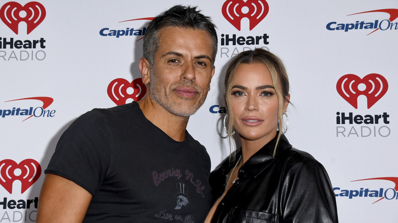 Teddi Mellencamp posing for photos with Edwin Arroyave