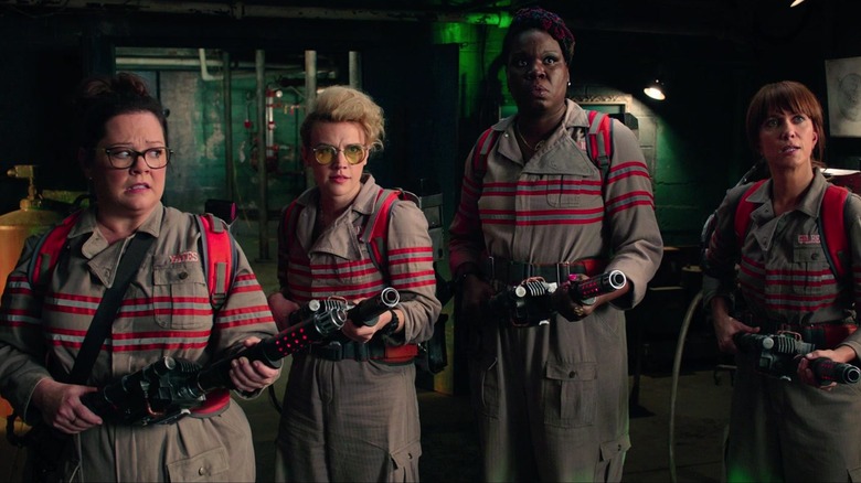 Ghostbusters hold proton packs