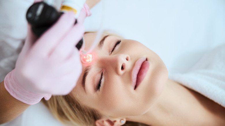 Woman getting Moxi laser treatment