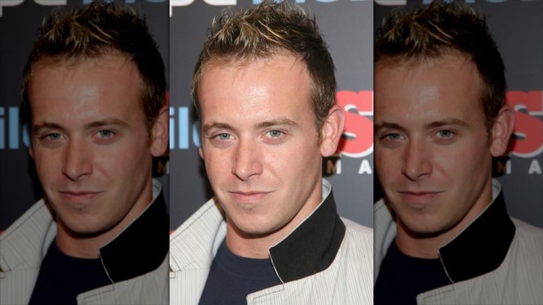 Tyler Duckworth on a step and repeat