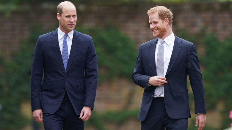 Prince William and Prince Harry walking and smiling together