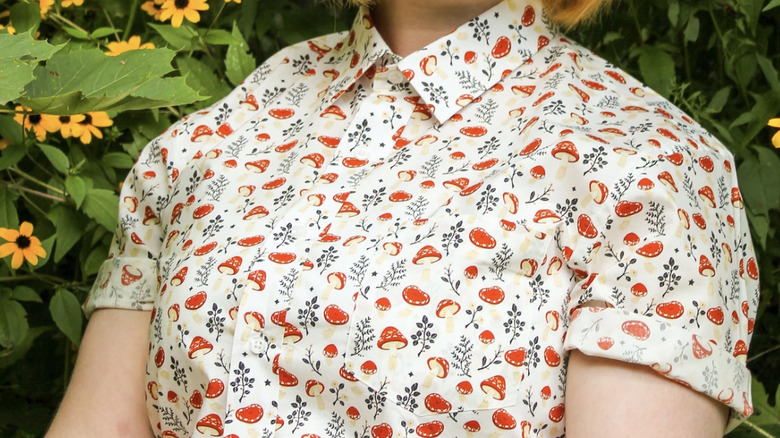 Model wearing mushroom-print shirt