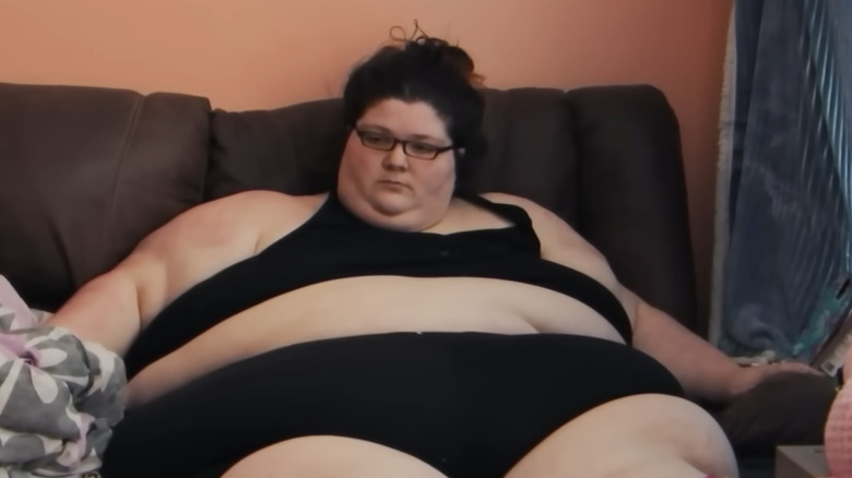 Gina Marie Krasley sitting on couch during an episode of "My 600-lb Life"