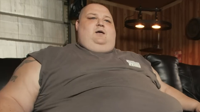 James 'L.B.' Bonner sitting on couch talking during episode of "My 600-lb Life"