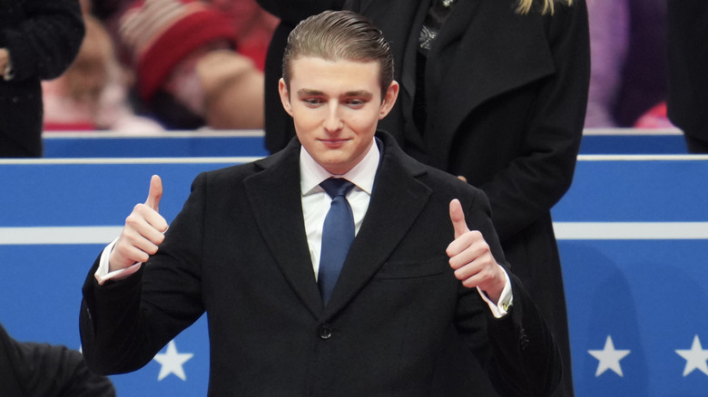 Barron Trump giving a thumbs up at the inauguration parade