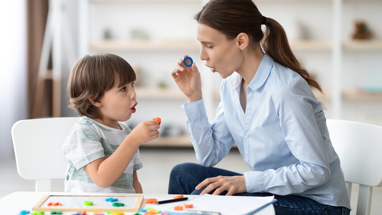 Teacher working with a child 