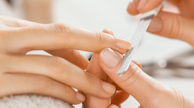 Nails getting manicured