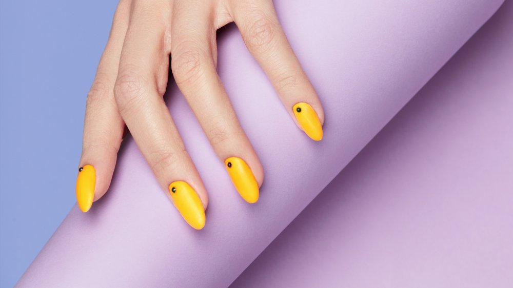 Yellow nails with appliqué, a 2020 nail trend