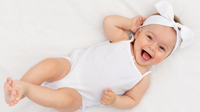 Happy baby in her crib