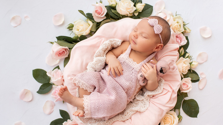 A baby on a bed of roses 