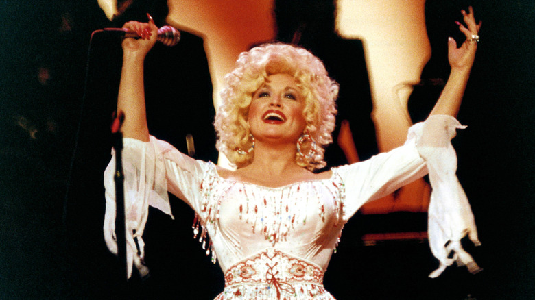 Dolly Parton performing with microphone