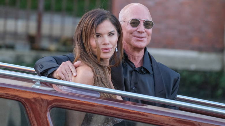 Lauren Sánchez and Jeff Bezos posing for photos in Venice