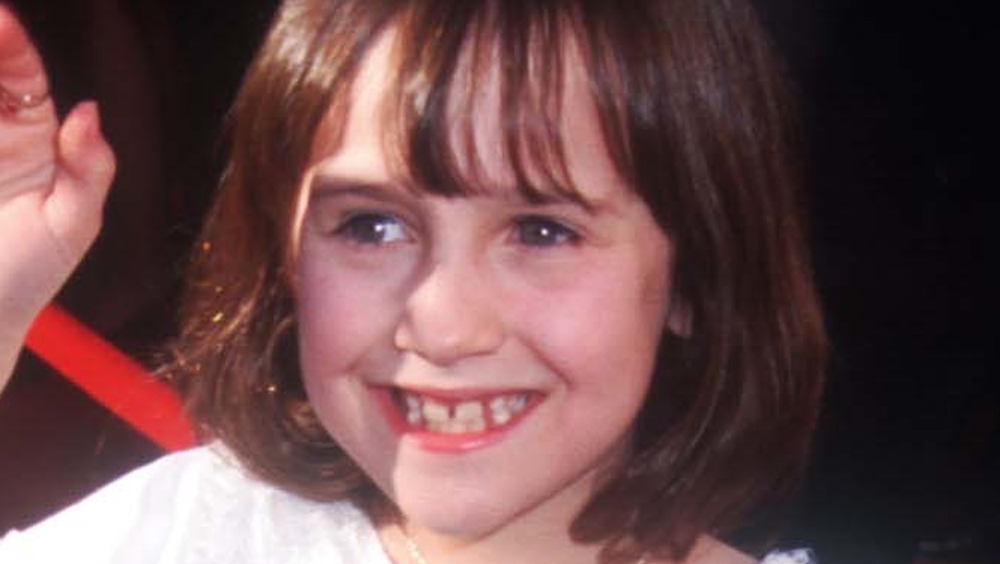 Mara Wilson smiling in 1995