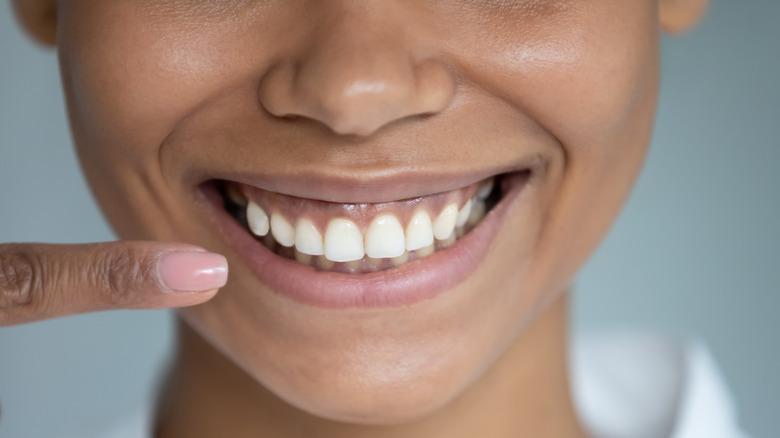 A woman flashing an ear-to-ear smile