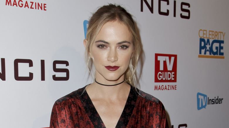 Emily Wickersham wearing red kimono-like gown