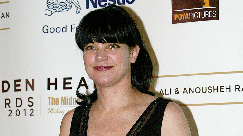 Pauley Perrette smirking