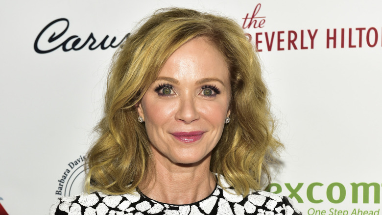 Lauren Holly smirking