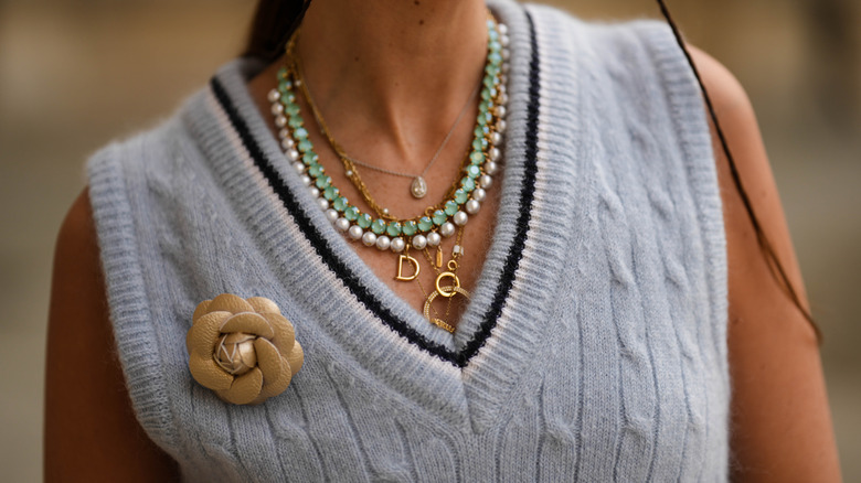 Closeup layered necklaces v neckline