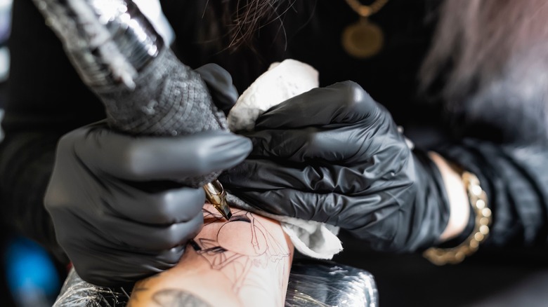 Closeup of a tattoo artist working