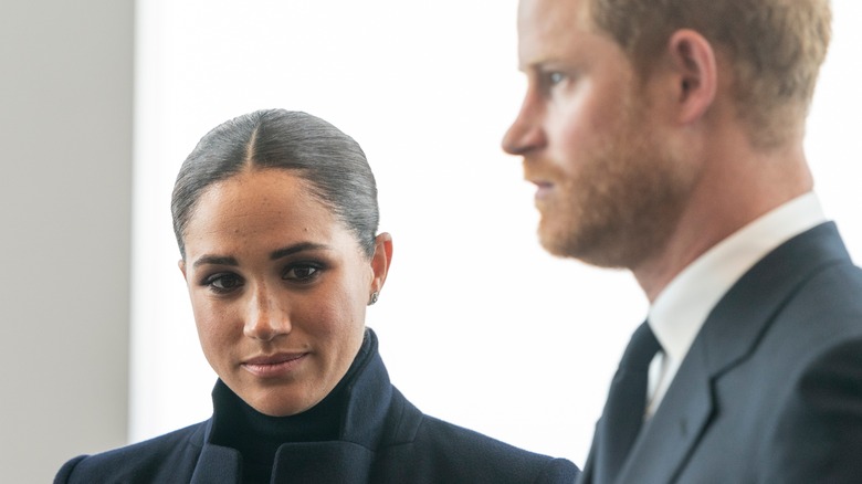 meghan and harry smiling at event