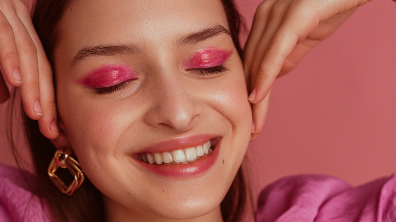 woman wearing neon pink eyeshadow