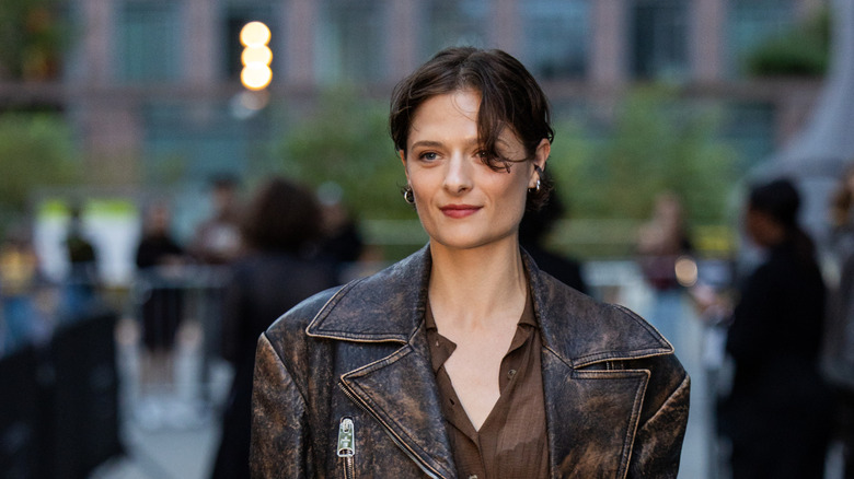 Louisa Jacobson in a brown leather jacket