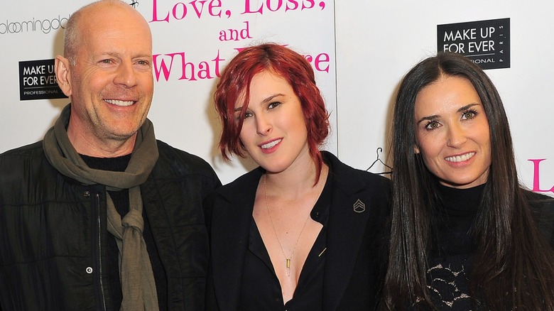 Bruce Willis, Rumer Willis, and Demi Moore on a red carpet together