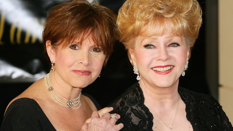 Carrie Fisher and Debby Reynolds posing together