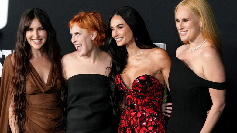 Tallulah Willis in strapless black dress with mom Demi Moore and sisters Rumer and Scout