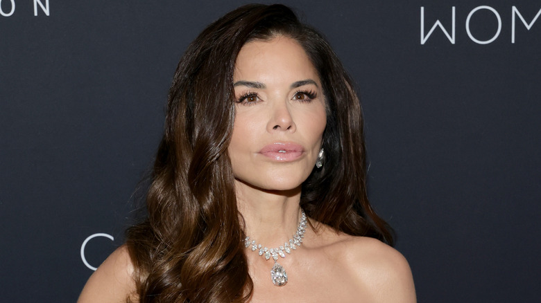 Close up of Lauren Sanchez Bezos in front of a black background.