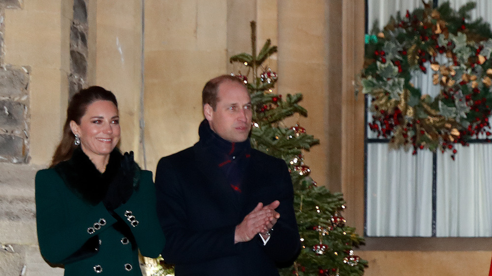Prince William and Kate by a Christmas tree