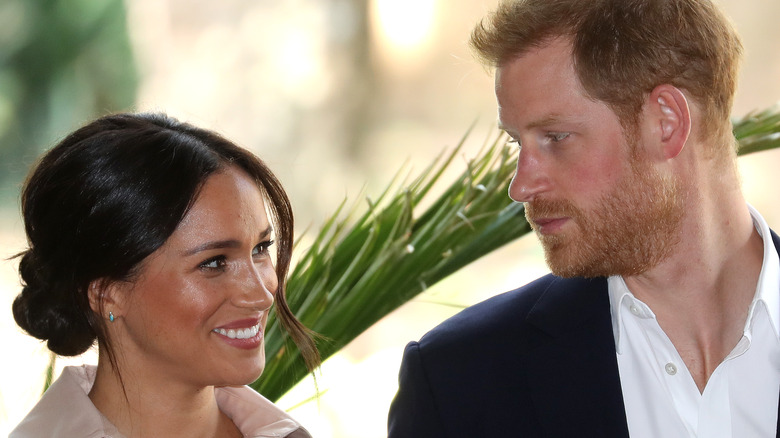 Meghan and Harry looking at each other