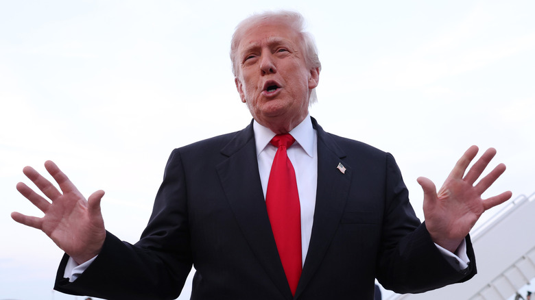 Donald Trump speaking to reporters after getting off of Air Force One