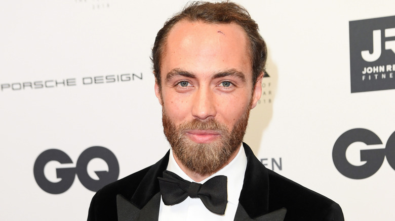 James Middleton smiling and wearing a bow tie.