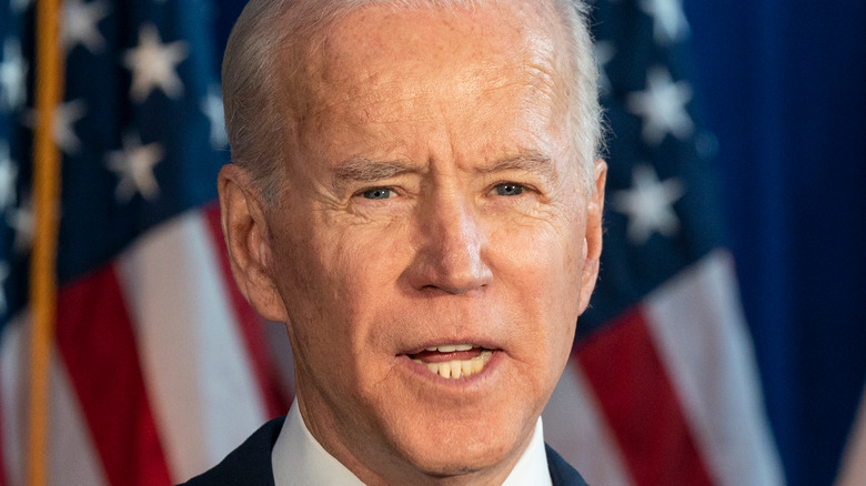 President Joe Biden speaks at a podium