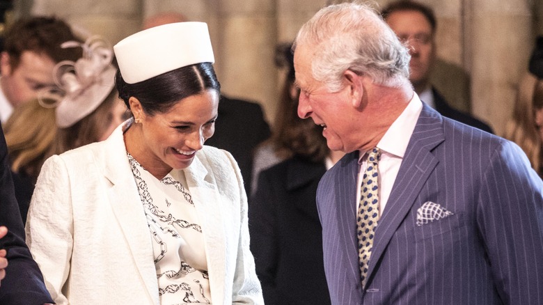 Meghan Markle and Prince Charles laughing March 2019